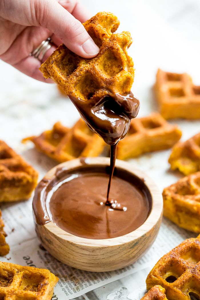 Chocolate sauce poured over waffles